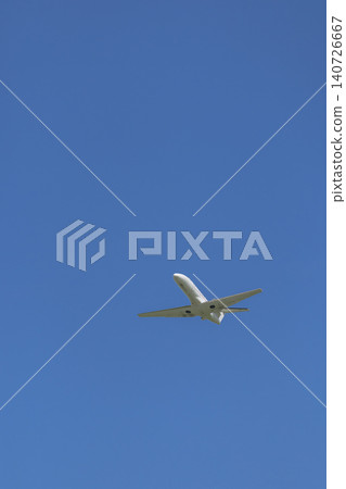 White airplane flying high in clear blue sky White airplane flying high in clear blue sky 140726667
