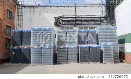 Pallets of beer bottles are awaiting shipment at the beer factory. Pallets of beer bottles are awaiting shipment at the beer factory. 140726675