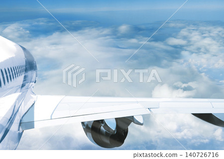 Passenger plane flight above clouds. Airplane wing rear view with empty space mockup. 140726716