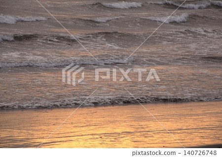 waves lit by the setting sun waves lit by the setting sun 140726748