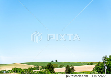 Hokkaido: Japan's Natural Landscape - Biei Town on a clear spring day (June 2026) 140726830
