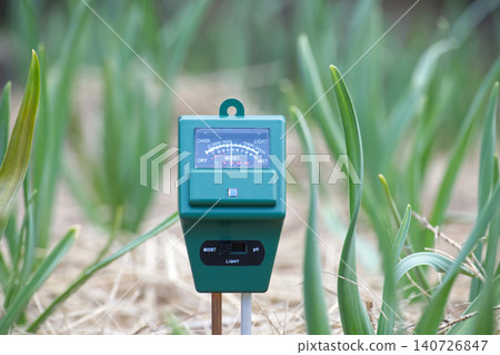 Gardening tool measures soil moisture, light, and pH levels for healthy plant growth Gardening tool measures soil moisture, light, and pH levels for healthy plant growth 140726847