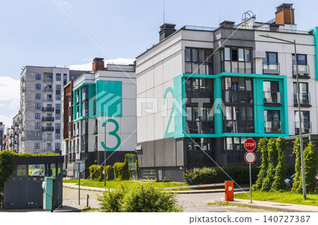 MINSK, BELARUS - JUNE 4, 2026: Modern apartment buildings with colorful facades in the Novaya Borovaya residential district 140727387