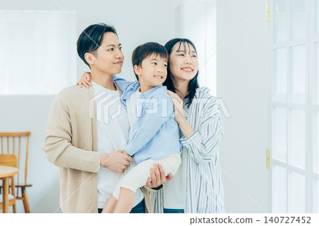 A family relaxing in the living room A family relaxing in the living room 140727452