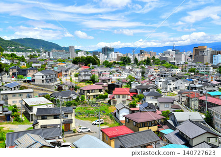 View of the area around the Nagano Prefectural Government building (back left) and the city of Nagano (Nagano City, Nagano Prefecture) [June 2026] 140727623