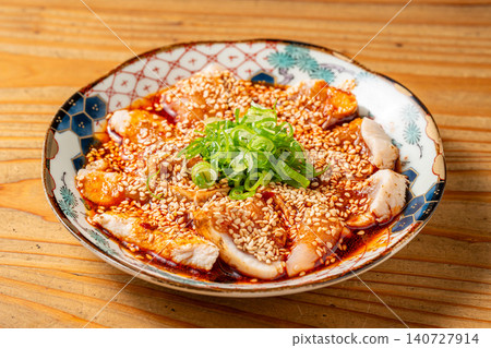 The spicy sauce is irresistible in this moist steamed chicken dish. The spicy sauce is irresistible in this moist steamed chicken dish. 140727914