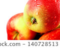 Macro closeup of fresh red apple with water droplets. Ripe organic fruit covered in wet dew drops isolated on white background. 140728513