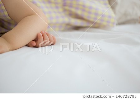 A one-year-old girl taking a nap 140728793