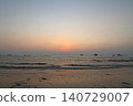 Mumbai Maharashtra India Jan 18 2026 Soft pink sunset fading over the Arabian Sea with gentle waves and wet shoreline at Juhu Beach creating a calm evening coastal landscape 140729007