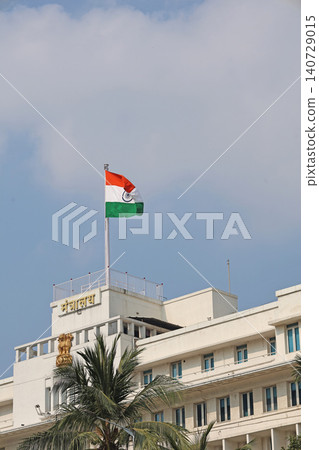 Mumbai Maharashtra India Jan 18 2026 Indian tricolor flying above Mantralaya rooftop with Maharashtra Secretariat signage against a bright blue sky Mumbai Maharashtra India Jan 18 2026 Indian tricolor flying above Mantralaya rooftop with Maharashtra Secretariat signage against a bright blue sky 140729015