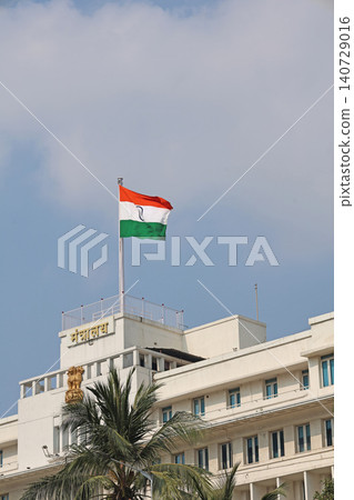 Mumbai Maharashtra India Jan 18 2026 Indian tricolor flying above Mantralaya rooftop with Maharashtra Secretariat signage against a bright blue sky Mumbai Maharashtra India Jan 18 2026 Indian tricolor flying above Mantralaya rooftop with Maharashtra Secretariat signage against a bright blue sky 140729016