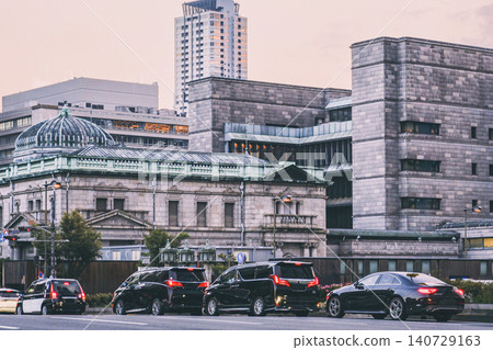 A cityscape where historical buildings and modern skyscrapers coexist. A cityscape where historical buildings and modern skyscrapers coexist. 140729163