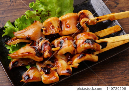 Delicious grilled squid on skewers Delicious grilled squid on skewers 140729206