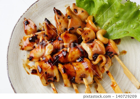 Delicious grilled squid on skewers Delicious grilled squid on skewers 140729209