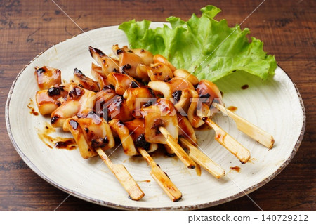 Delicious grilled squid on skewers Delicious grilled squid on skewers 140729212