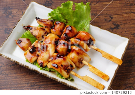 Delicious grilled squid on skewers Delicious grilled squid on skewers 140729213