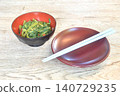 stir fried slice Chinese morning glory with chili in soybean paste on bowl with chopsticks 140729235