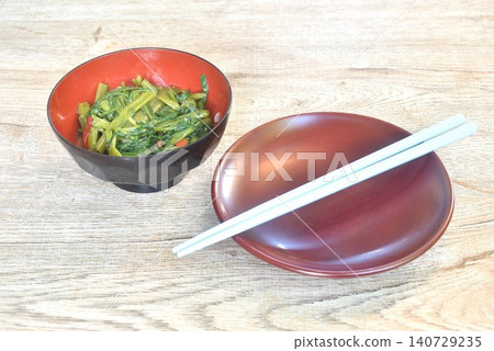 stir fried slice Chinese morning glory with chili in soybean paste on bowl with chopsticks 140729235