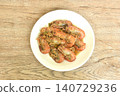 deep fried salty river shrimp with chop garlic and chili pepper arranging on plate  140729236