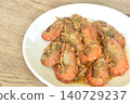 deep fried salty river shrimp with chop garlic and chili pepper arranging on plate  140729237