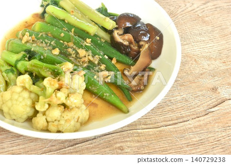 stir fried cauliflower and roselle with cabbage topping black mushroom in gravy garlic soy sauce on plate 140729238