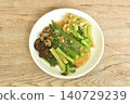 stir fried cauliflower and roselle with cabbage topping black mushroom in gravy garlic soy sauce on plate 140729239