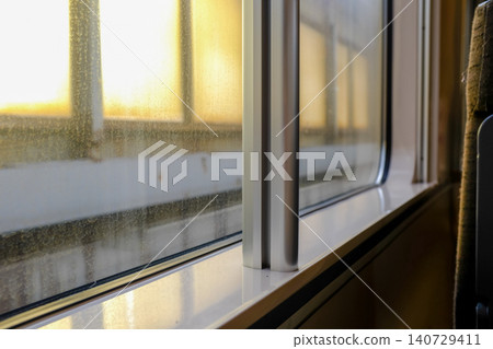 Looking from the train windows with sunlight. Reflection from the light. Heading to Sapporo, Hokkaido, Japan. Travel and nature concept. Looking from the train windows with sunlight. Reflection from the light. Heading to Sapporo, Hokkaido, Japan. Travel and nature concept. 140729411
