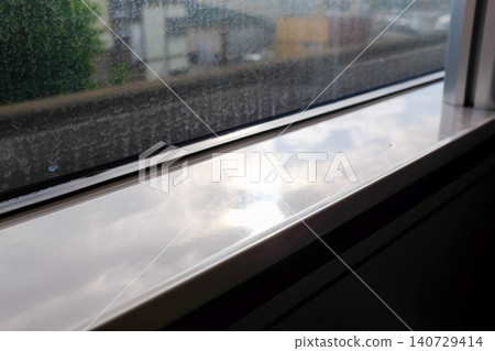 Looking from the train windows with sunlight. Reflection from the light. Heading to Sapporo, Hokkaido, Japan. Travel and nature concept. Looking from the train windows with sunlight. Reflection from the light. Heading to Sapporo, Hokkaido, Japan. Travel and nature concept. 140729414
