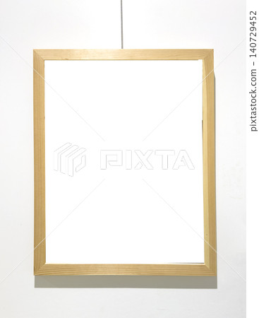 Golden frame hangs on string with empty interior space. Suspended border encloses blank area ready artwork insertion mockup. Golden frame hangs on string with empty interior space. Suspended border encloses blank area ready artwork insertion mockup. 140729452