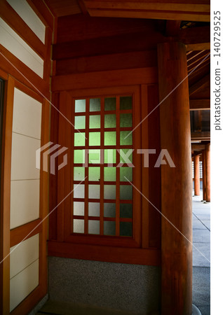 Close-up of the wood window of Japanese shrine. Traditional building. Building exterior. Close-up of the wood window of Japanese shrine. Traditional building. Building exterior. 140729525
