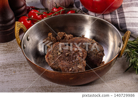 Braised beef cheek meat in copper pan with vegetables Braised beef cheek meat in copper pan with vegetables 140729986