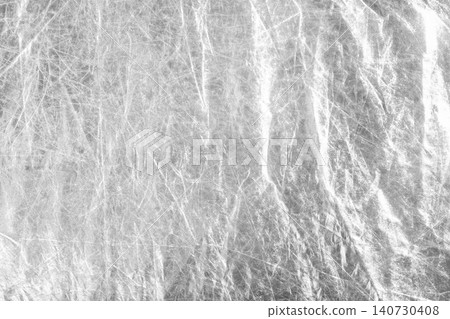 White crumpled reflective surface with textured folds. Abstract background with light reflection and material structure. Concept of modern backdrop design.. White crumpled reflective surface with textured folds. Abstract background with light reflection and material structure. Concept of modern backdrop design.. 140730408