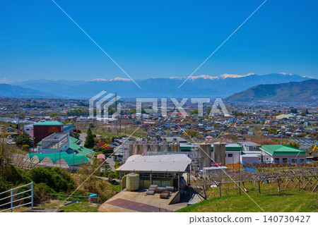 View of the Southern Alps from Katsunuma-cho, Koshu City, Yamanashi Prefecture in spring (including Minami-Alps City, Chuo City, Kai City, etc.) View of the Southern Alps from Katsunuma-cho, Koshu City, Yamanashi Prefecture in spring (including Minami-Alps City, Chuo City, Kai City, etc.) 140730427