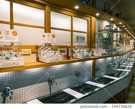 [#Matsuyama] Inside the store: A tap that dispenses orange juice. 140730626