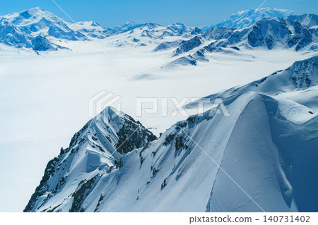 Glaciers and snow-capped mountains as seen from a scenic flight over Mount Logan Base Camp in Kluane National Park, Yukon Territory, Canada. 140731402