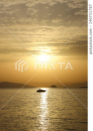 sunset on the beach. Seaside town of Turgutreis and spectacular sunsets. Selective Focus. sunset on the beach. Seaside town of Turgutreis and spectacular sunsets. Selective Focus. 140731787