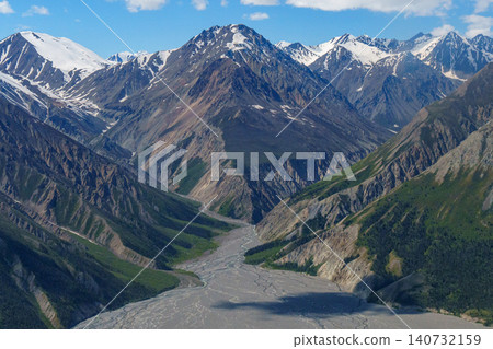 Kluane National Park, Yukon Territory, Canada: A breathtaking aerial view of the magnificent mountainous landscape created by glaciers. A must-see tourist attraction. Kluane National Park, Yukon Territory, Canada: A breathtaking aerial view of the magnificent mountainous landscape created by glaciers. A must-see tourist attraction. 140732159