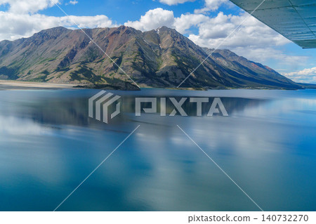Kluane National Park, Yukon Territory, Canada: A breathtaking view of Lake Kluane and its reflection in the mountains from above. A must-see tourist attraction. Kluane National Park, Yukon Territory, Canada: A breathtaking view of Lake Kluane and its reflection in the mountains from above. A must-see tourist attraction. 140732270