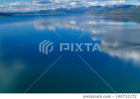 Kluane National Park, Yukon Territory, Canada: A breathtaking view of Lake Kluane and its reflection in the mountains from above. A must-see tourist attraction. Kluane National Park, Yukon Territory, Canada: A breathtaking view of Lake Kluane and its reflection in the mountains from above. A must-see tourist attraction. 140732272