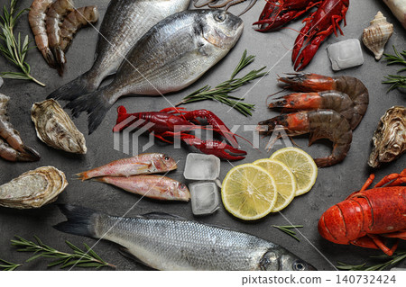Fresh fish and seafood on grey table, flat lay 140732424