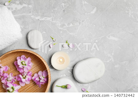 Flat lay composition with spa stones on light grey marble table, space for text Flat lay composition with spa stones on light grey marble table, space for text 140732442