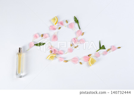 Flat lay composition with bottle of perfume on white background Flat lay composition with bottle of perfume on white background 140732444