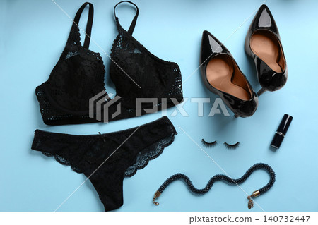 Flat lay composition with sexy women's underwear on light blue background Flat lay composition with sexy women's underwear on light blue background 140732447