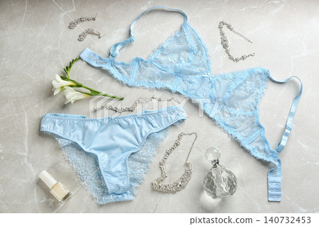 Flat lay composition with women's underwear on light grey background Flat lay composition with women's underwear on light grey background 140732453
