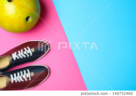 Bowling ball and shoes on color background, flat lay. Space for text Bowling ball and shoes on color background, flat lay. Space for text 140732460
