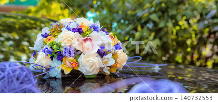 Wedding bouquet on the hood of a white retro car Wedding bouquet on the hood of a white retro car 140732553