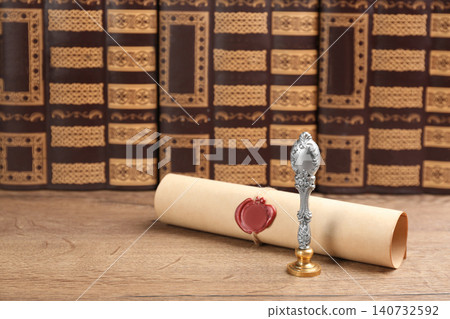 Notary's public pen and sealed document on wooden table Notary's public pen and sealed document on wooden table 140732592
