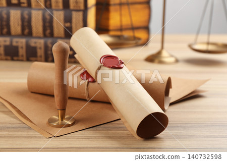 Notary's public pen and documents with wax stamp on wooden table, closeup Notary's public pen and documents with wax stamp on wooden table, closeup 140732598
