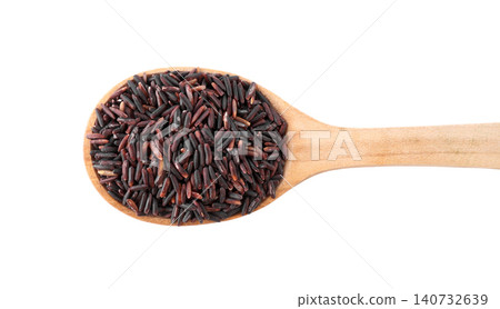Brown rice in wooden spoon isolated on white, top view 140732639