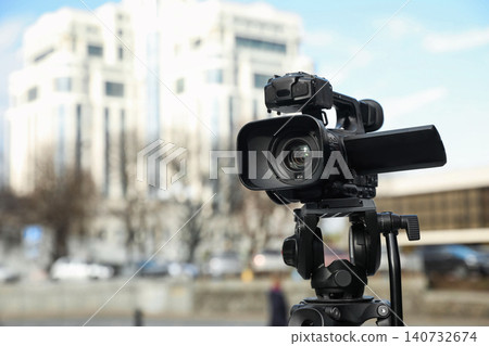 Professional video camera outdoors. Space for text 140732674